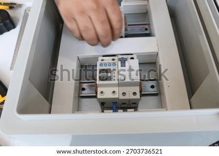 Installing automatic circuit breaker into home electrical panel