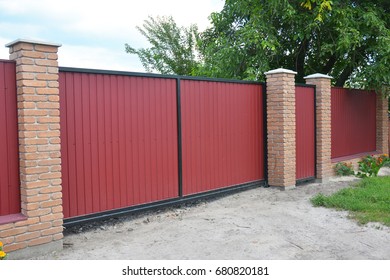 Installing Brick And Metal Fence Gate With Door. Red Metal Fencing Panels.