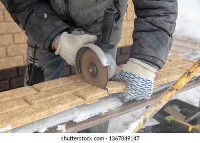 Installing Brick Siding On The Wall Of The House .