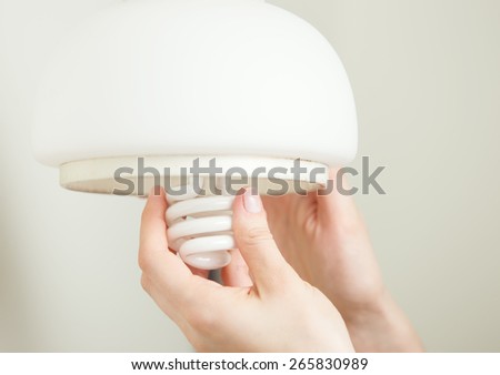 Installing energy efficient compact fluorescent light