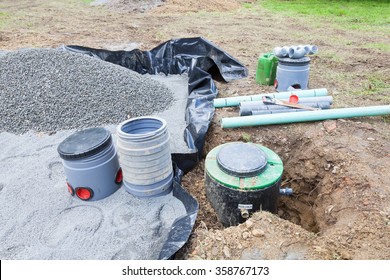 Installing The Gravel Filter Bed And Pump For A Septic Tank Sanitation System For A Residential House For The Disposal Of Wastewater And Sewage