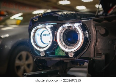 Installing The Headlight On The Car. Repair Of Car Headlights. Tuning And Restoration Of Automotive Optics. Installation Of The Bi LED Lens In The Headlight Housing.