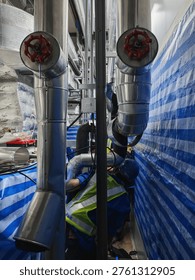 Installing a jacketed insulated flex duct involves extending the duct sealing the inner core to the collar with tape and a clamp and pulling the insulation jacket over the joint, sealing it with tape.