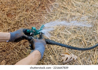 Installing, Maintaining, And Watering Lawn Sprinkler System By Professional Landscape Technician Near New Home