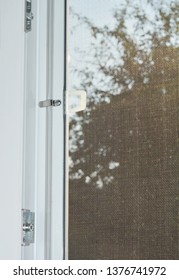 Installing Mosquito Wire Screen On House Window To Protect From Insects. Mosquito Wire Screen Close Up. 