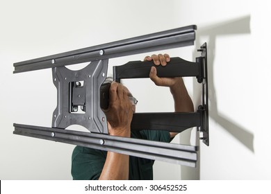 Installing Mount TV On The Wall At Home