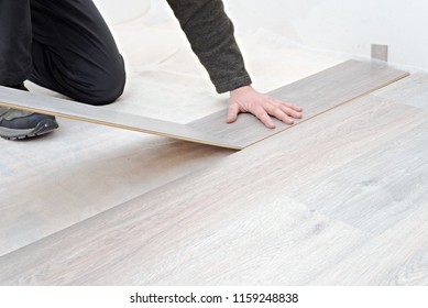  installing new laminated wooden floor. copy space - Shutterstock ID 1159248838