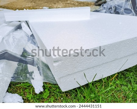 installing rigid styrofoam insulation board for energy saving of the house wall