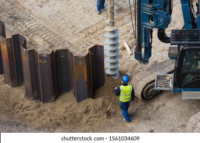 Installing Sheet Piling On Construction Site With Drilling Rig