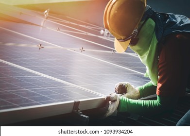 Installing a Solar Cell on a Roof - Shutterstock ID 1093934204