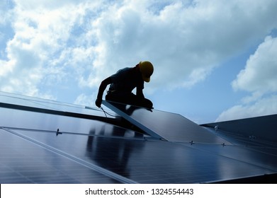 Installing a Solar Cell on a Roof, Shadow image - Shutterstock ID 1324554443
