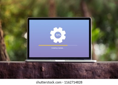 Installing Update Process With Gearbox Percentage Progress And Loading Bar On Laptop / Computer Screen Concept