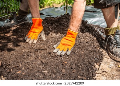 Installing weed control fabric material and bark mulch in a residential garden to control weed spreading