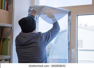 Installing Window Film In The Office. Protection From Ultraviolet Radiation. Protective Film.