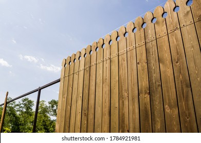 Installing a wooden fence on a dacha plot. - Shutterstock ID 1784921981