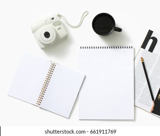 Instant camera along with sketch pad and magazine