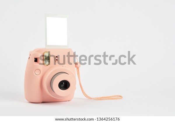 Instant camera on\
white