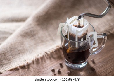 Instant Drip Coffee Using Paper Type Filter With Beans On Wooden Background