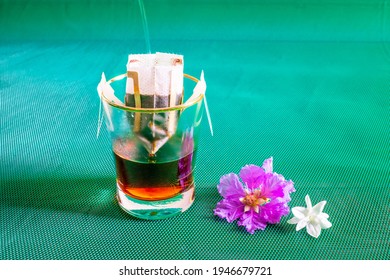 Instant Drip Coffee Using Paper Type Filter With Beans On Green Background.