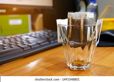 Instant Drip Fresh Coffee With Filter Paper Using To Drink On Mug Cup On Table At Office.