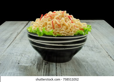 Instant Noodle In The Bowl On Wooden Background