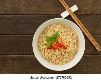 Instant Noodles In Bowls On Wood Table. Top View