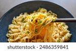 Instant noodles with chopsticks in a bowl. 