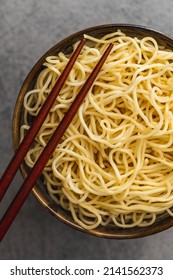 Instant Noodles. Cooked Chinese Noodles In A Bowl. Top View.