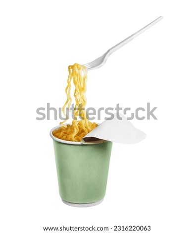 Instant noodles on a plastic fork from a cardboard cup