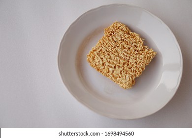 Instant Noodles On White Plate. Tasty Fast Food And Easy To Cook. The Best Food During Bad Economic Times 