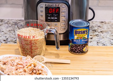 Instant Pot Dinner Preparation With Brown Rice, Chicken And Black Beans