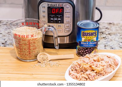 Instant Pot Dinner Preparation With Brown Rice, Chicken And Black Beans