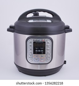 An InstaPot pressure cooker on a white backgrouind