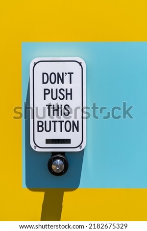 The instruction above the button: "Don't push this button".