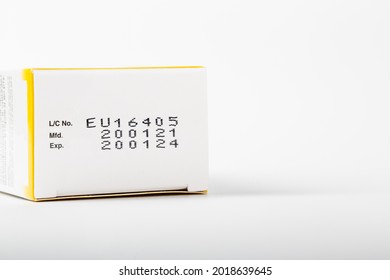 Instruction Of Lot Number, Manufacturing Date, And Expiry Date Label Of A Product On The Bottom Lid Of The Package With Isolated White Background And Copy Space.