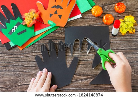 Instructions, step 13. Greeting card halloween on wooden table. Children's creativity project, crafts, crafts for kids.