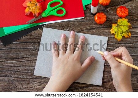 Instructions, step 2. Greeting card halloween on wooden table. Children's creativity project, crafts, crafts for kids.