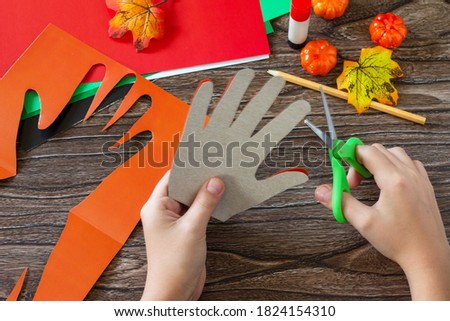 Instructions, step 3. Greeting card halloween on wooden table. Children's creativity project, crafts, crafts for kids.