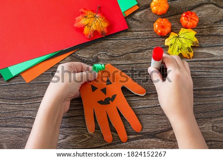 Instructions, step 6. Greeting card halloween on wooden table. Children's creativity project, crafts, crafts for kids.