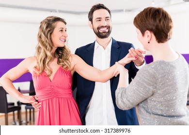 Instructor In Dance School With Couple Of Man And Woman