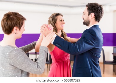 Instructor In Dance School With Couple Of Man And Woman