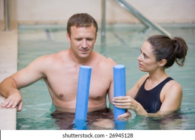 Instructor And Patient Undergoing Water Therapy