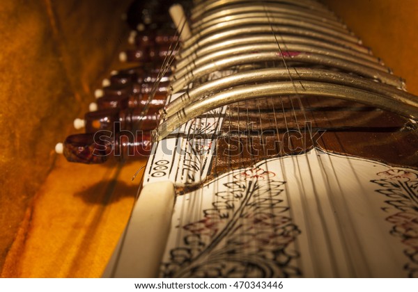 Instrument case with Sitar, a string traditional\
Indian musical instrument.\
Close-up