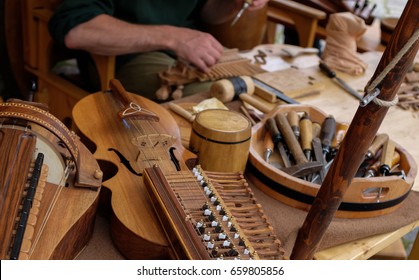 An Instrument Maker In Making Wooden Musical Instruments