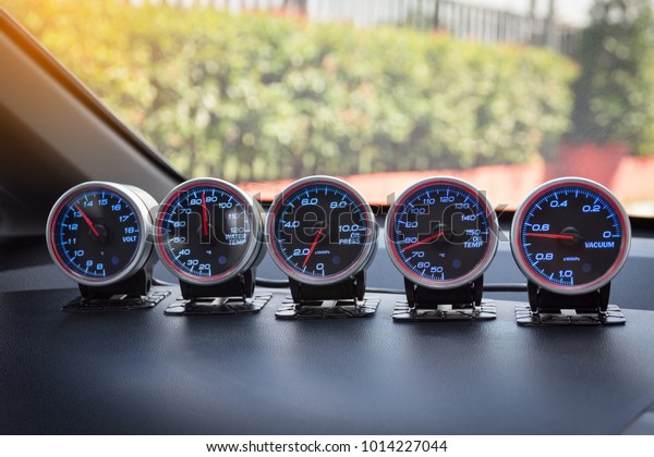 Instrument panel and tachometer from a modern\
high performance\
automobile.
