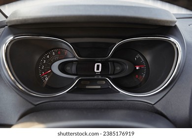 Instrument panel with tachometer and speedometer. Close up image of illuminated car dashboard.