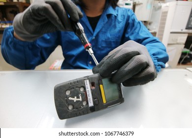 Instrument Technician Is Repairing Or Function Check Of Personal Gas Tester Or Gas Detector For The Job Calibration Of Gas.