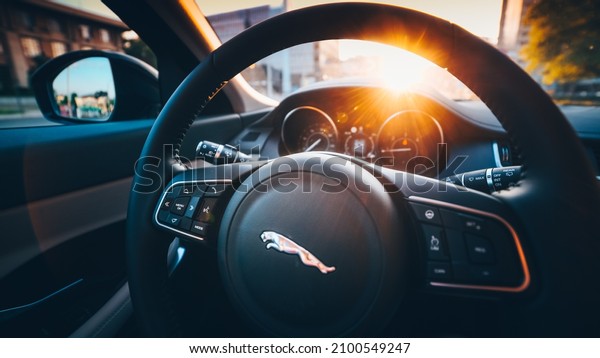 Instrumental cluster display and steering wheel of\
a Jaguar E-Pace SUV luxury car in sunrise light. Automotive\
industry. Romania,\
2018.