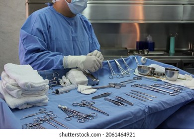 Instrumentalist nurse preparing the medical instruments for the operation. - Powered by Shutterstock