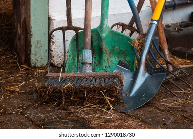 Instruments / equipment at a farm - broom, shovel, pitchfork  - Shutterstock ID 1290018730